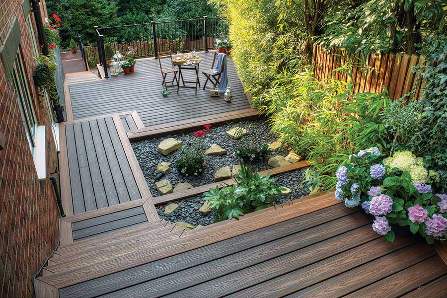 Trex Transcend composite decking on sloped garden in Lava Rock colour